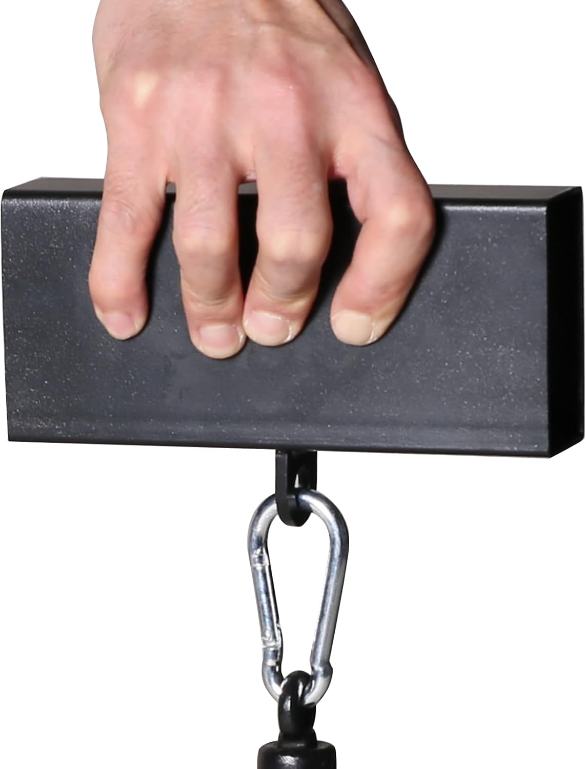 Hand holding a black rectangular weight with a hanging carabiner on a white background