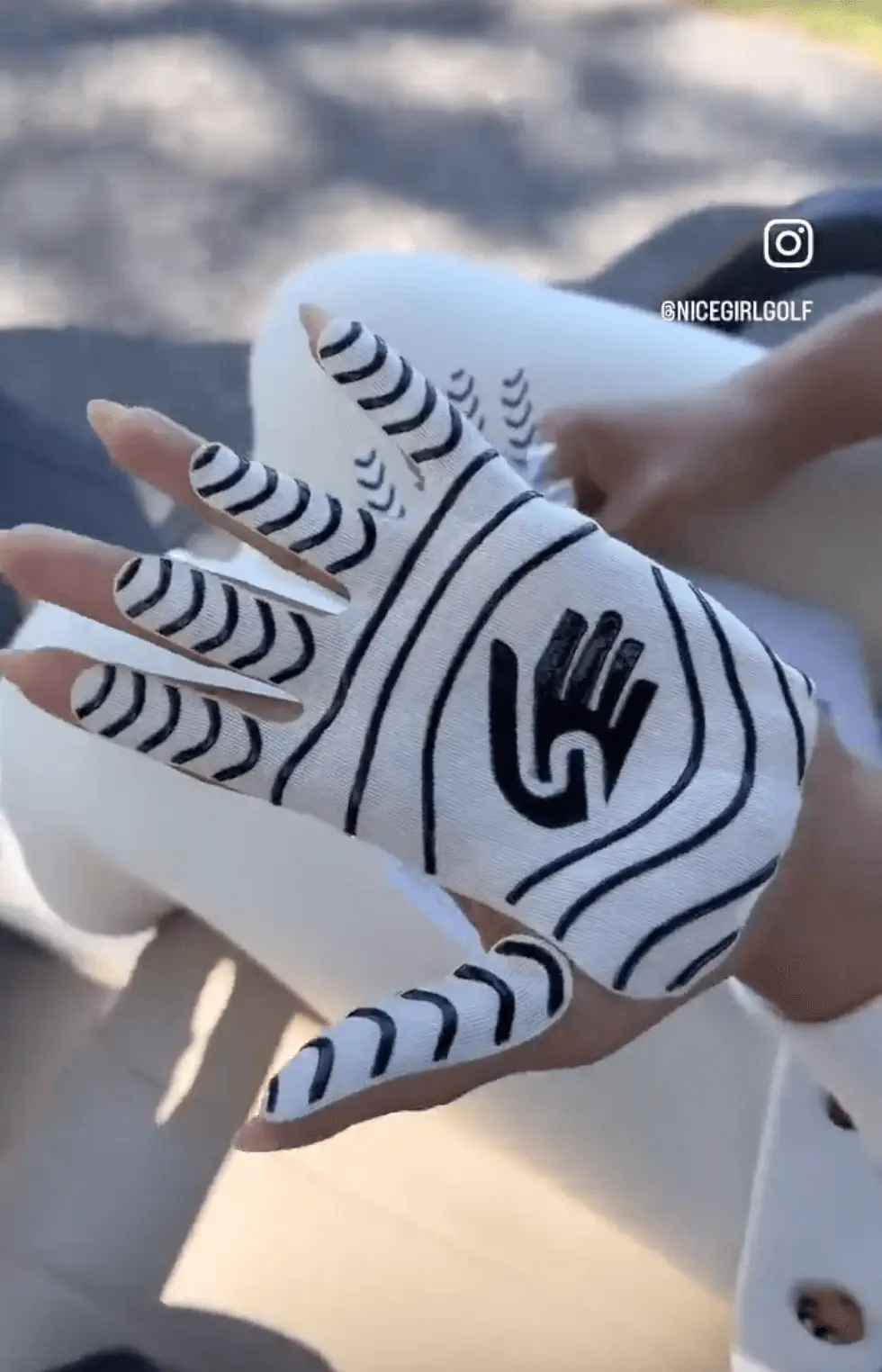 Golf glove alternative woman showing shadowz on her hand
